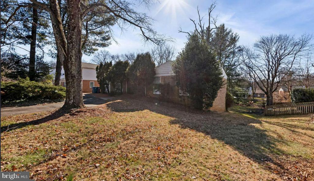 7923 Lewinsville Road McLean, VA 22102 - Photo 3 of 4 a backyard of a house with lots of green space