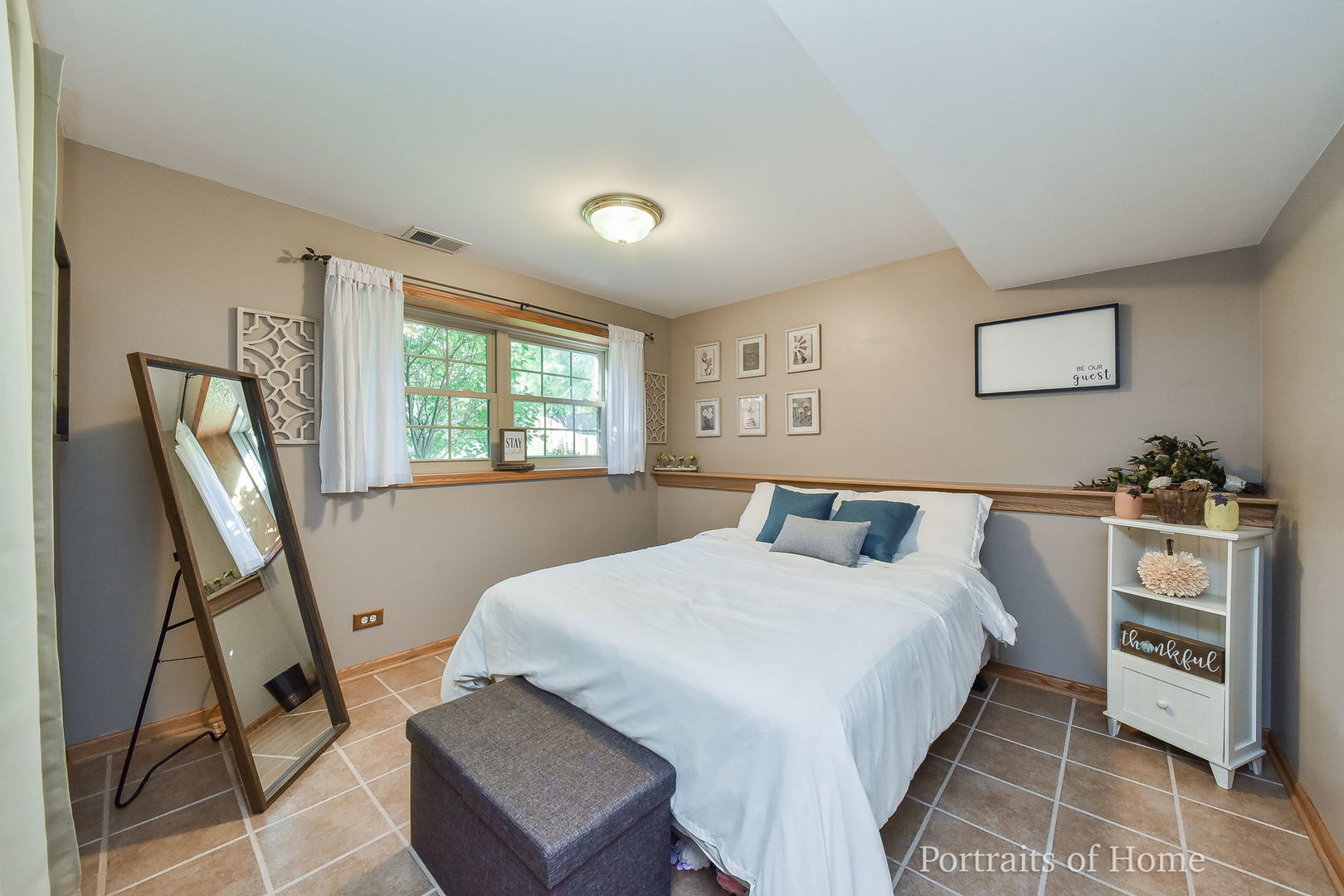 119 Reston Court Roselle, IL 60172 - Photo 16 of 25 a bedroom with a bed a couch and a window