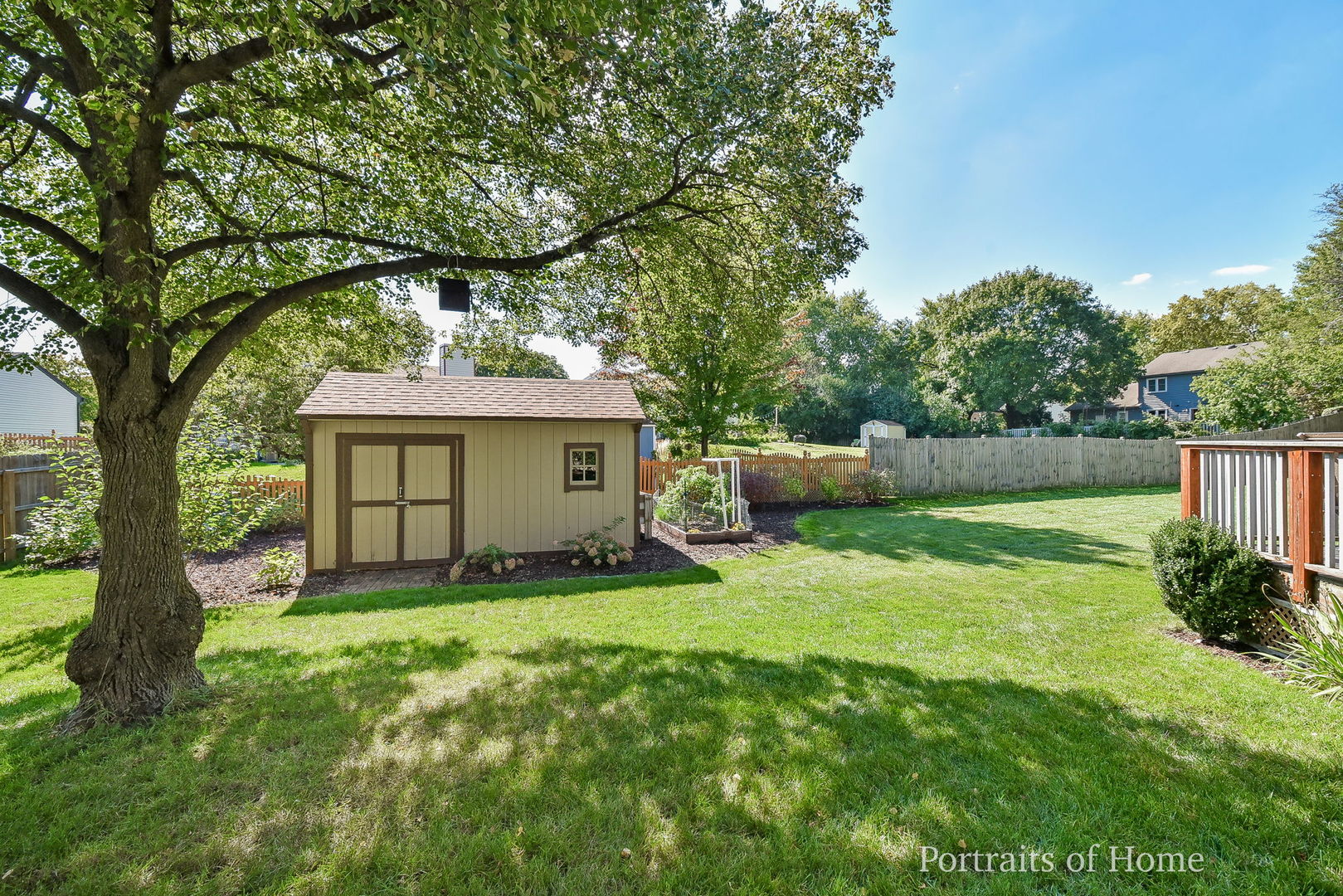 119 Reston Court Roselle, IL 60172 - Photo 23 of 25 a front view of a house with a garden and trees