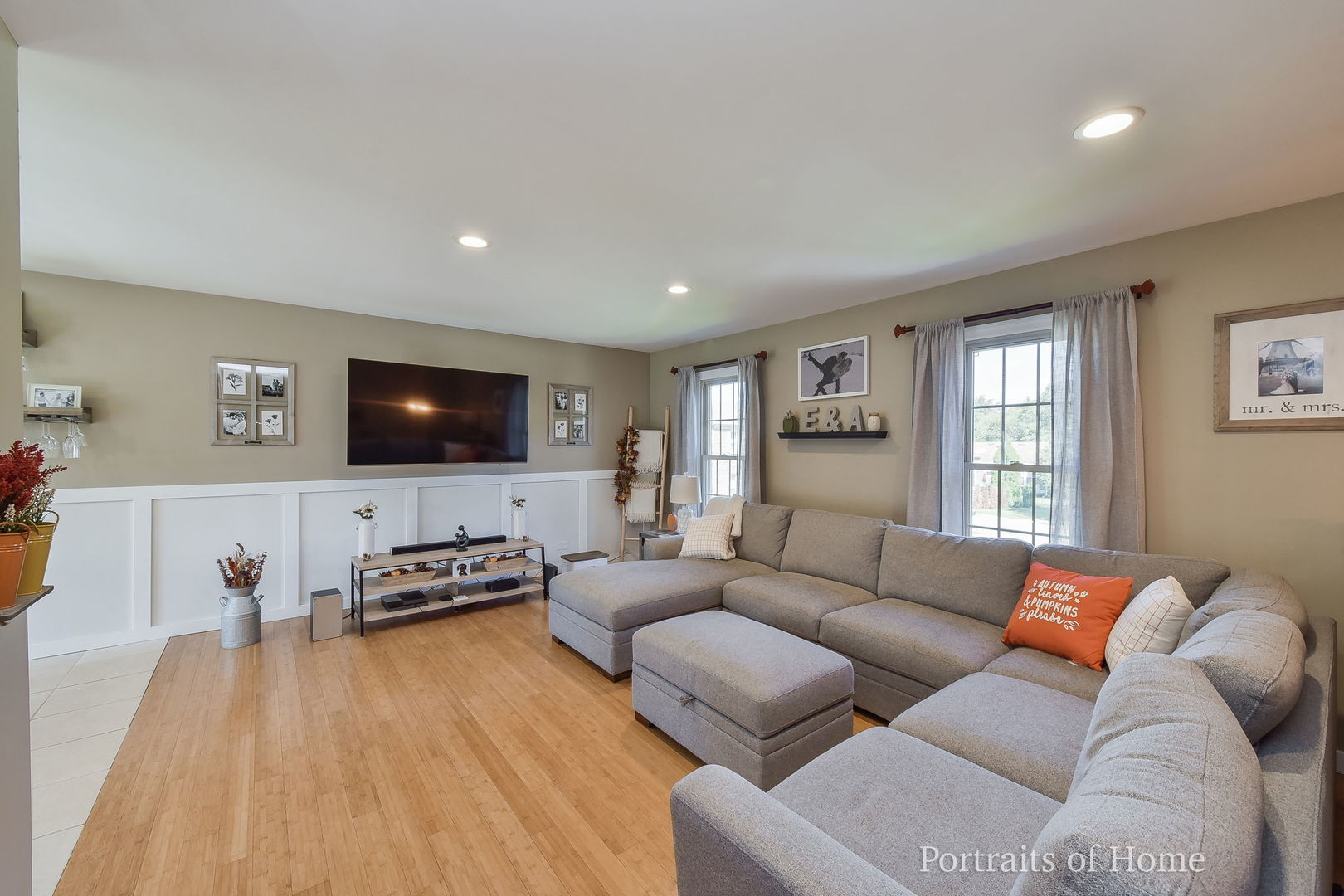 119 Reston Court Roselle, IL 60172 - Photo 4 of 25 a living room with furniture and a flat screen tv