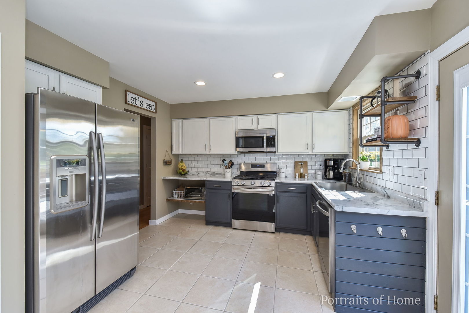119 Reston Court Roselle, IL 60172 - Photo 8 of 25 a large kitchen with stainless steel appliances lots of counter top space