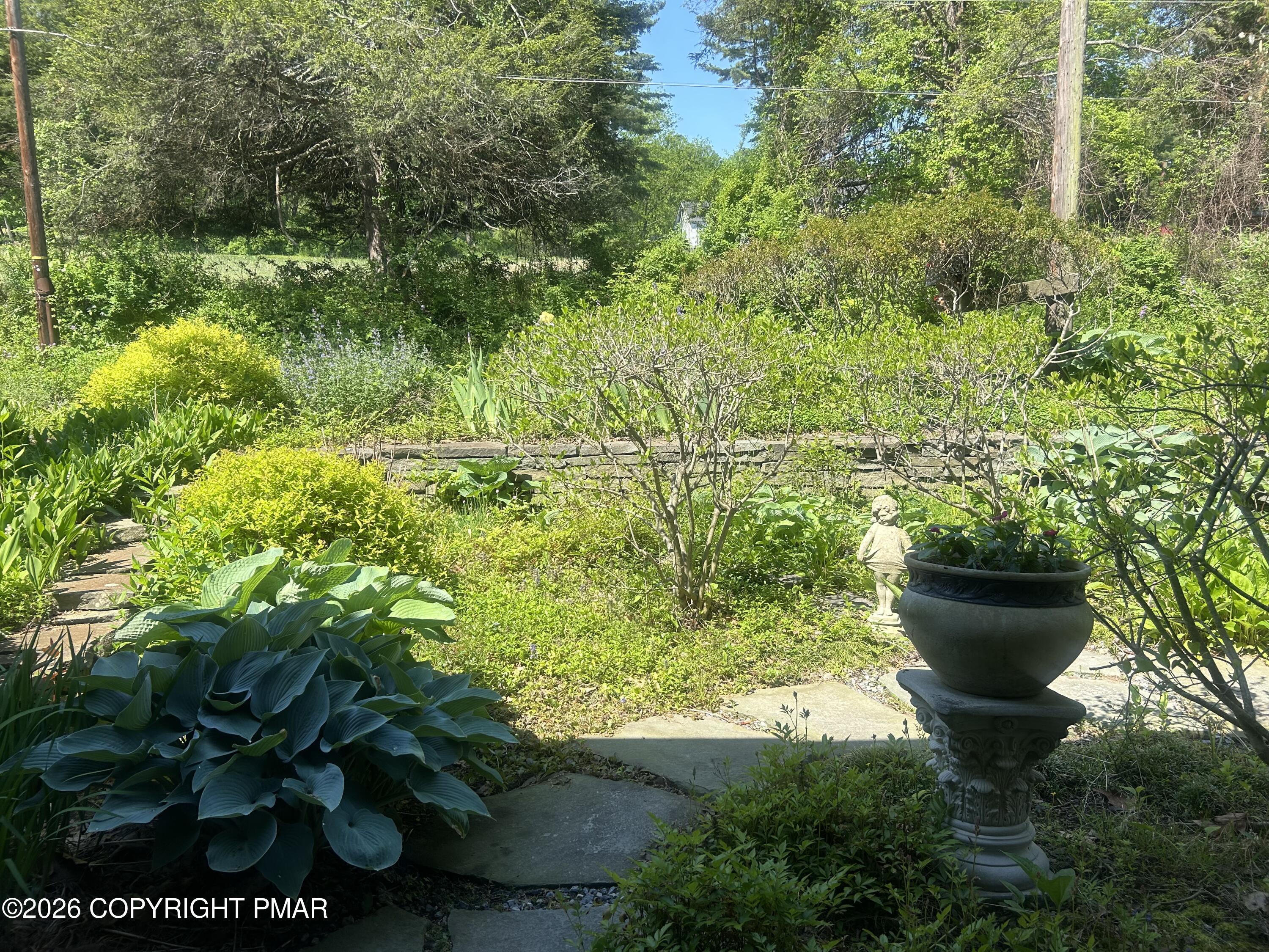 4379 River Road Mount Bethel, PA 18343 - Photo 15 of 48 a view of a garden with a fountain