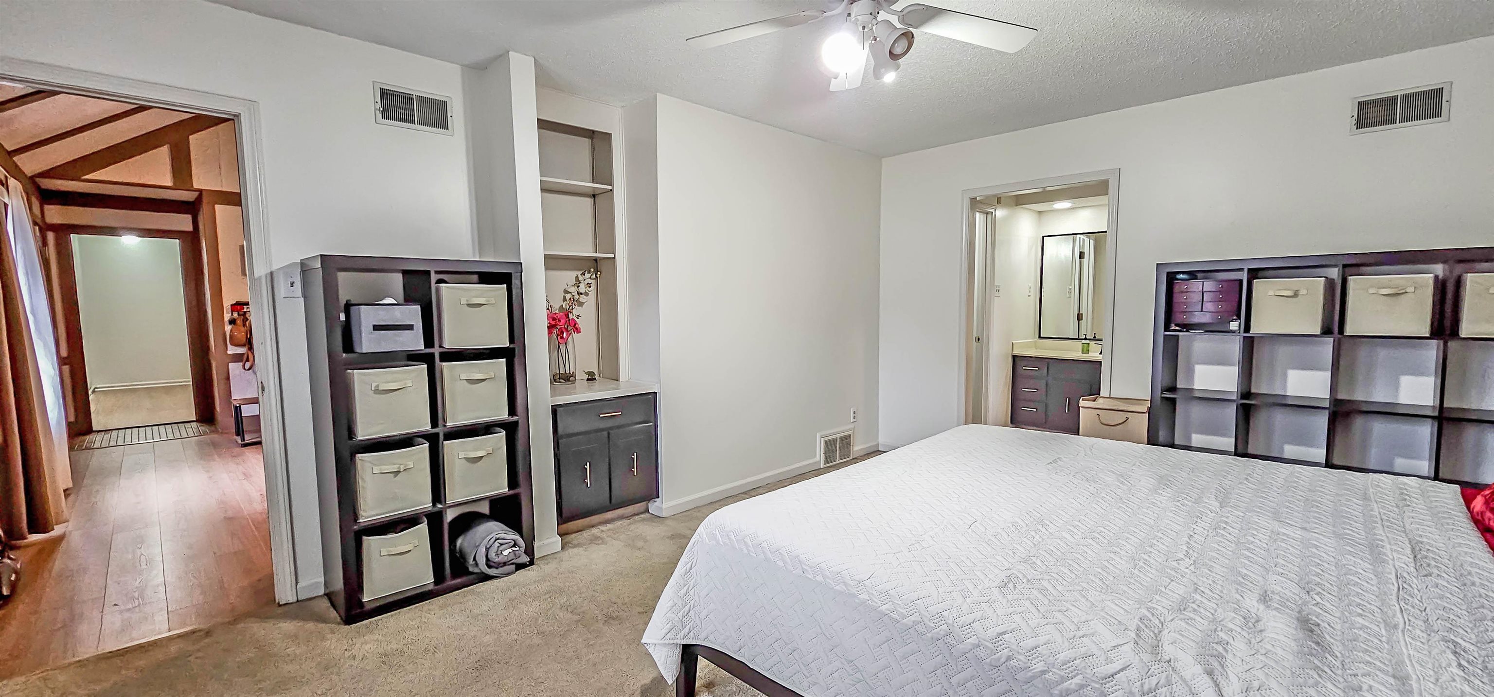 3204 Ruskin Road Memphis, TN 38134 - Photo 14 of 24 a bedroom with a bed and a chandelier