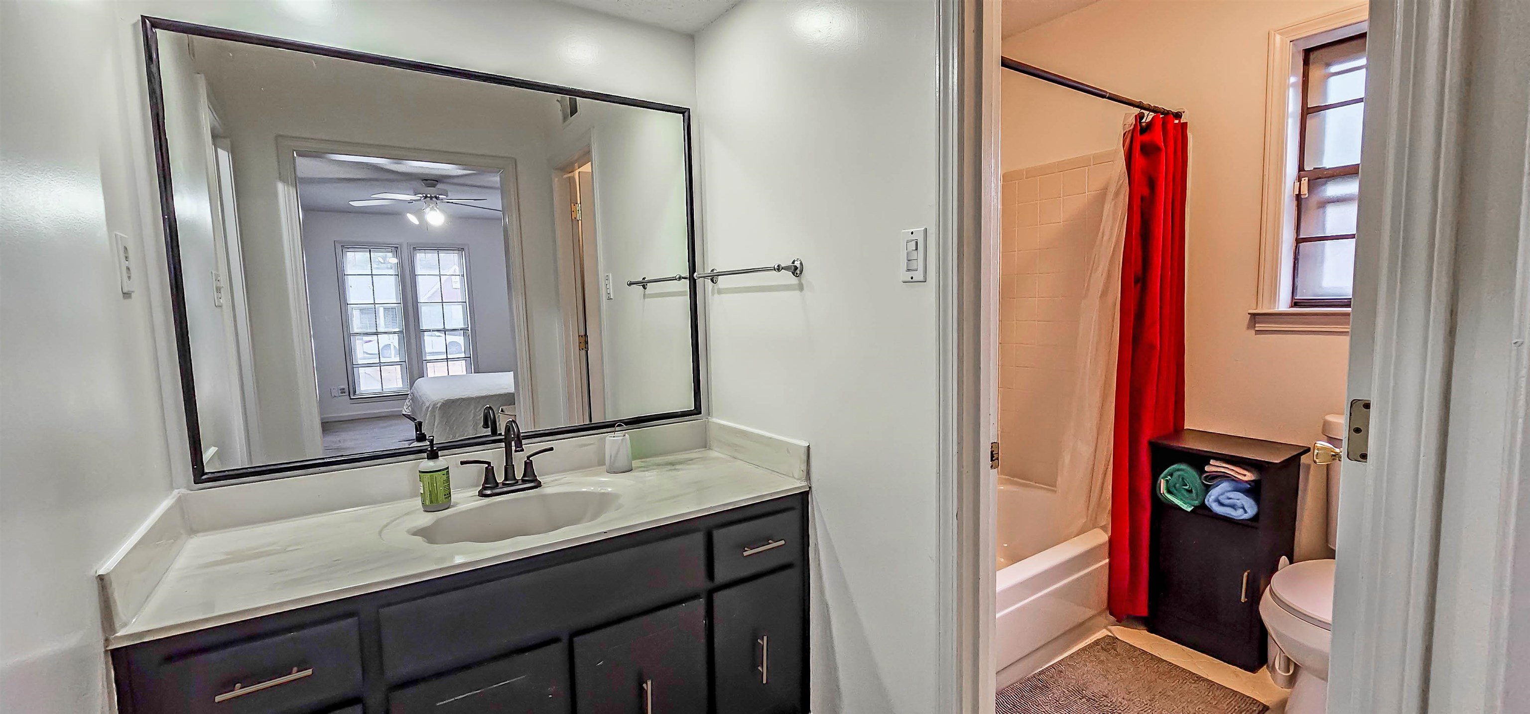 3204 Ruskin Road Memphis, TN 38134 - Photo 15 of 24 a en suite bathroom with a granite countertop sink and a mirror