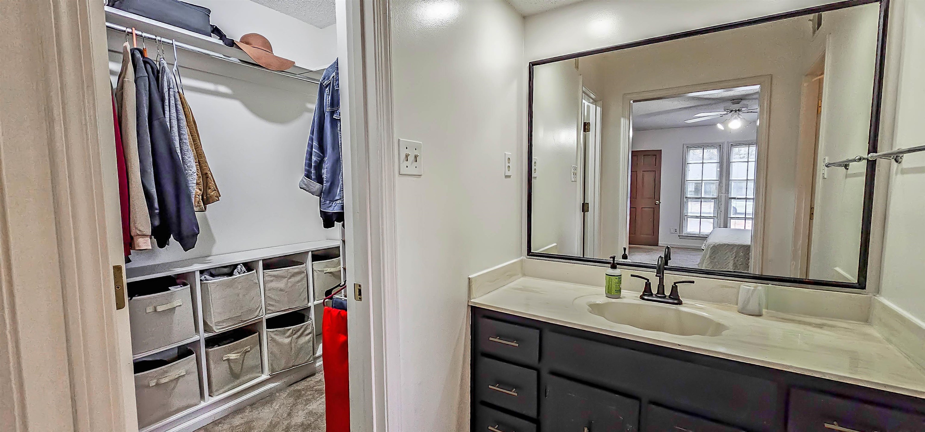 3204 Ruskin Road Memphis, TN 38134 - Photo 16 of 24 a bathroom with a double vanity sink and a mirror