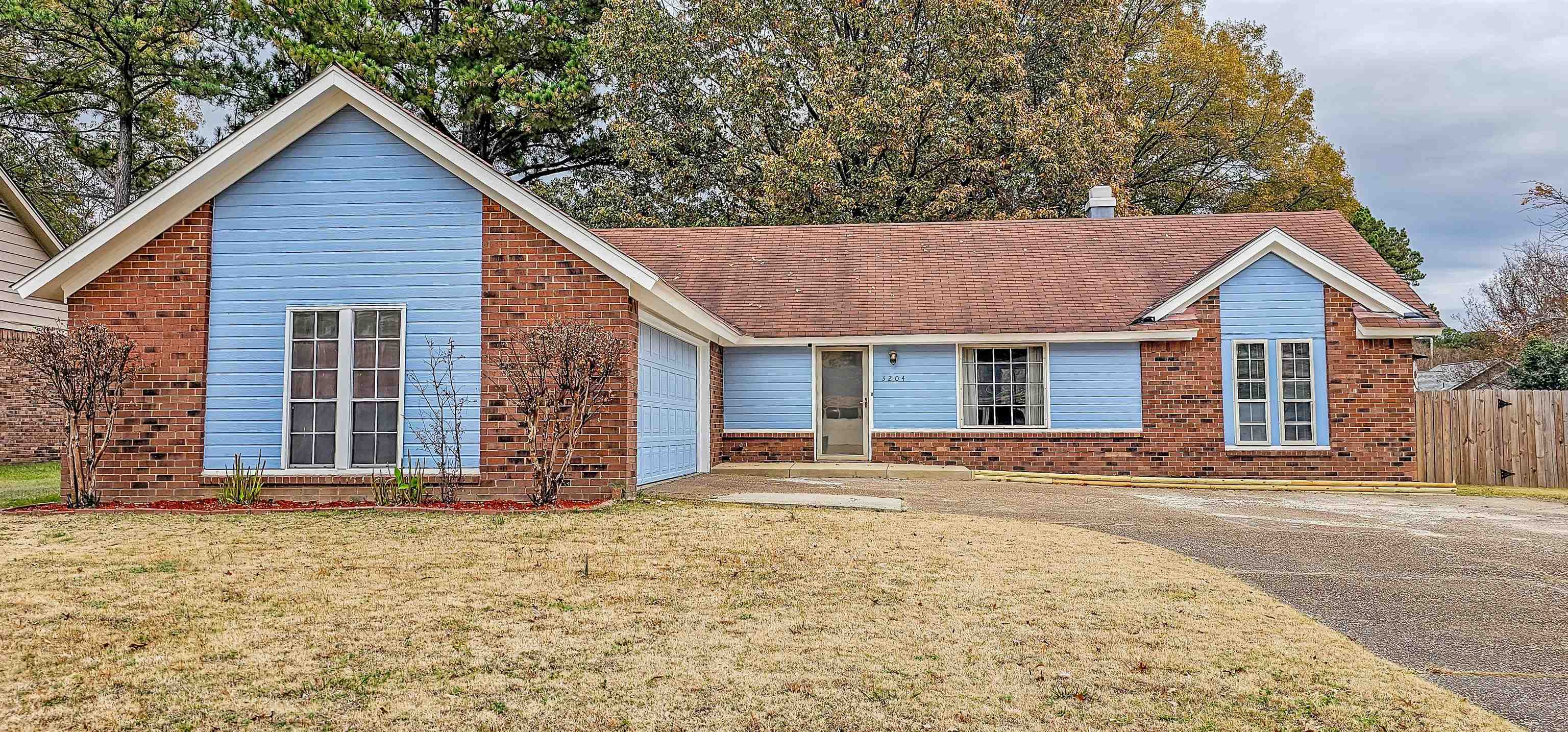 3204 Ruskin Road Memphis, TN 38134 - Photo 2 of 24 a front view of a house with garden