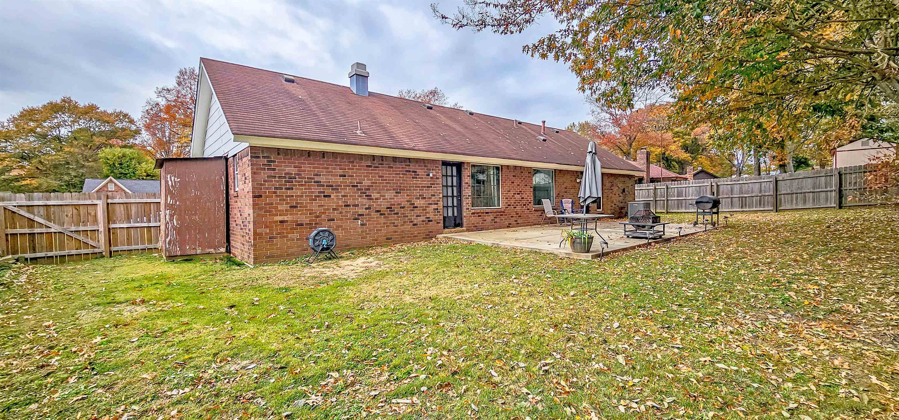 3204 Ruskin Road Memphis, TN 38134 - Photo 23 of 24 a backyard of a house with yard and outdoor seating