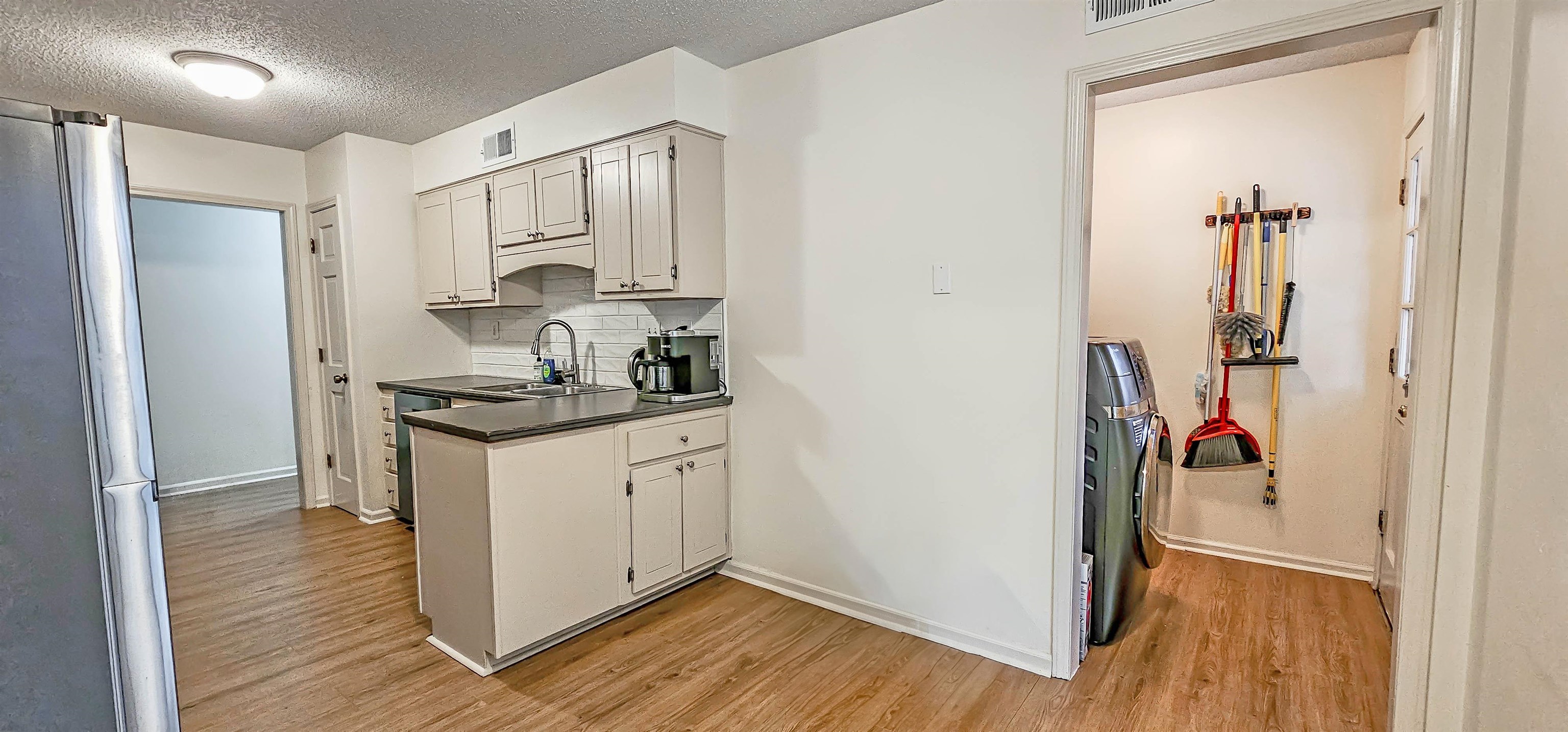 3204 Ruskin Road Memphis, TN 38134 - Photo 7 of 24 a very nice looking room with wooden floor and a window