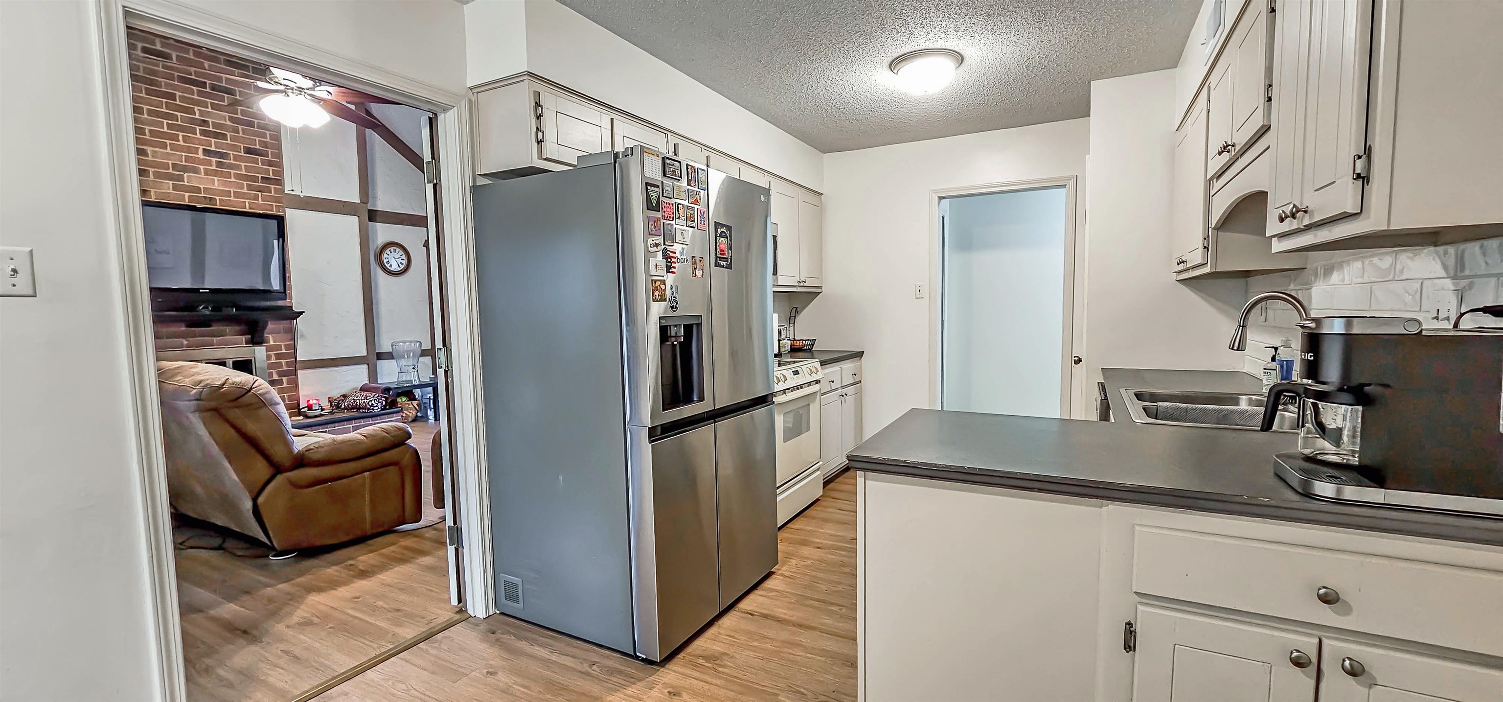 3204 Ruskin Road Memphis, TN 38134 - Photo 9 of 24 a kitchen with stainless steel appliances granite countertop a refrigerator and a sink
