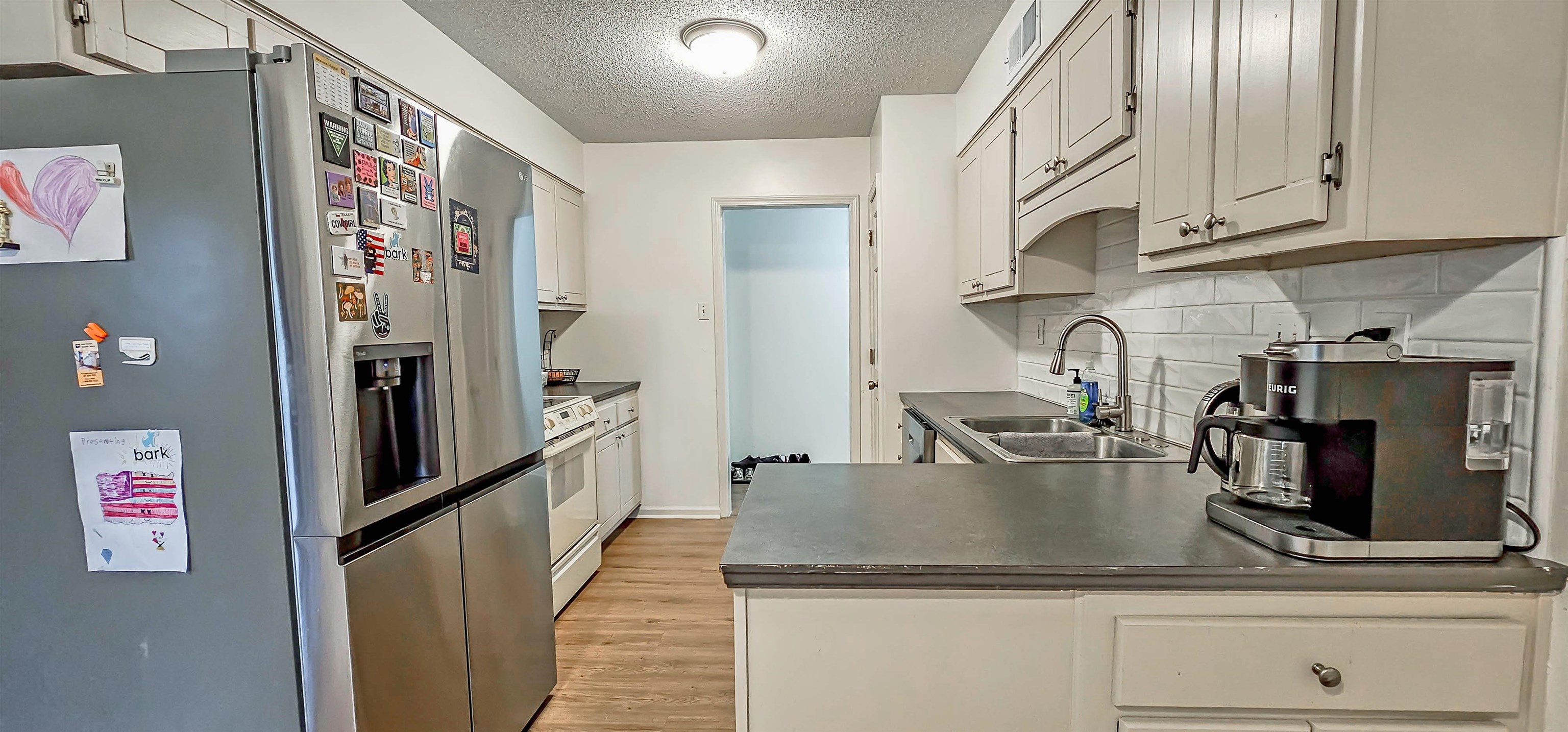 3204 Ruskin Road Memphis, TN 38134 - Photo 10 of 24 a kitchen with stainless steel appliances granite countertop a refrigerator and a sink