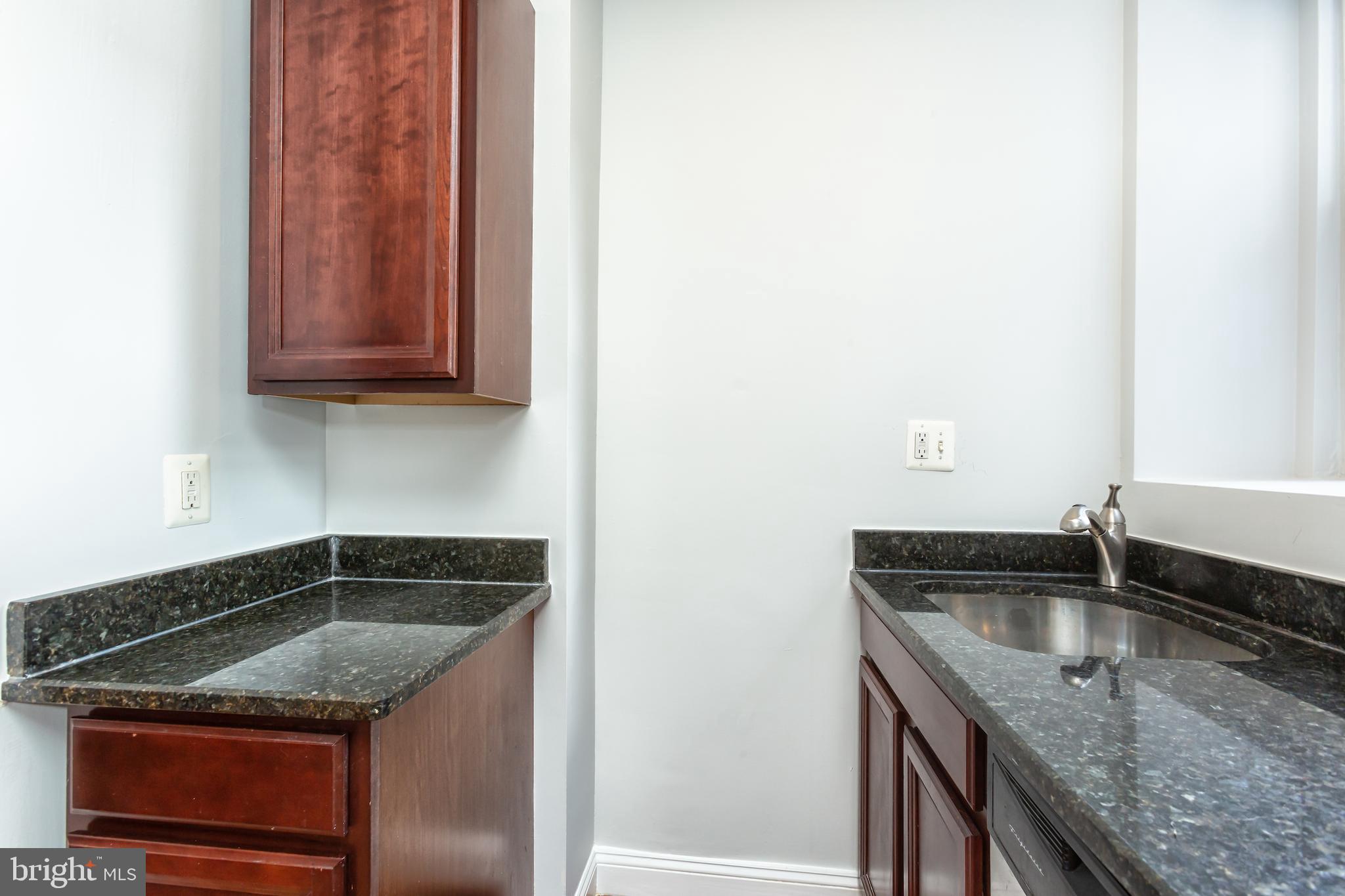424 Ridge Street Northwest, Unit 5 Washington, DC 20001 - Photo 9 of 18 Kitchen with stainless steel appliances