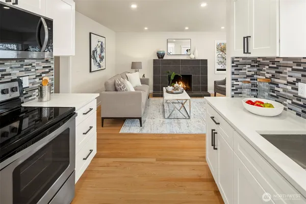 a kitchen with stainless steel appliances granite countertop a stove and a sink