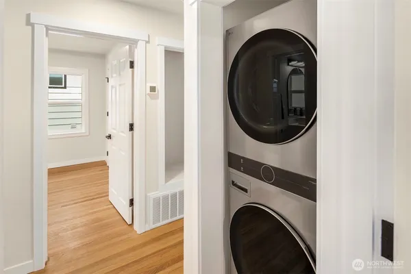 a view of a hallway with washer and dryer