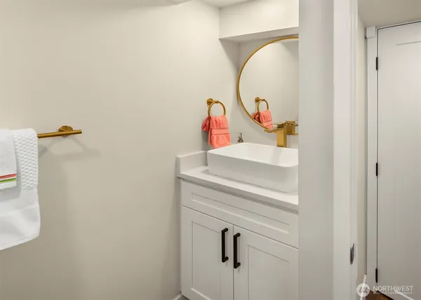 a bathroom with a sink and mirror