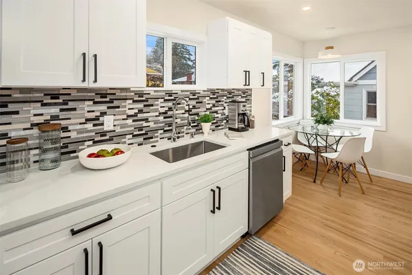 a kitchen with a sink and appliances
