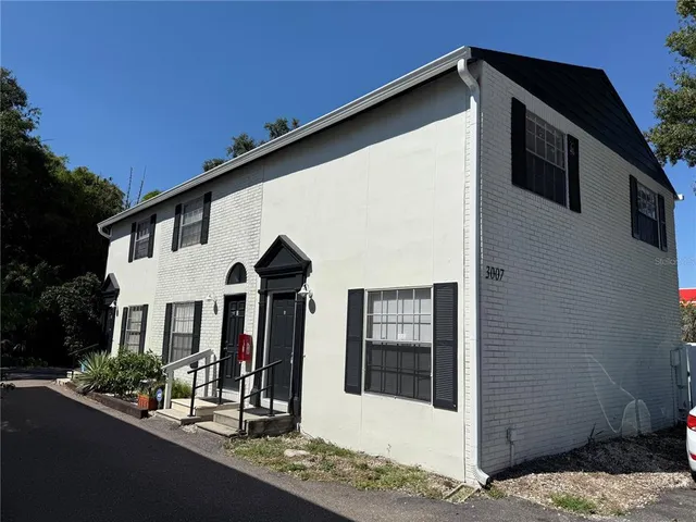 a front view of a house with yard