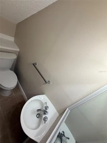 a bathroom with a sink and toilet