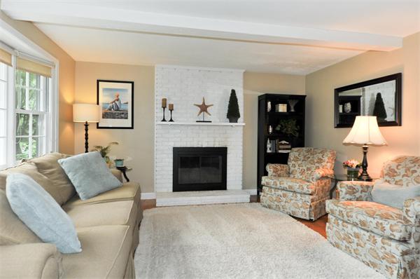 23 Amble Road Chelmsford, MA 01824 - Photo 8 of 20 a living room with furniture and a fireplace