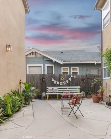 a front view of a house with outdoor seating