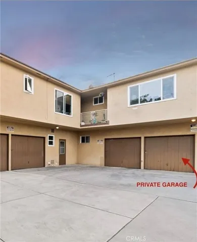 a front view of a building with garage