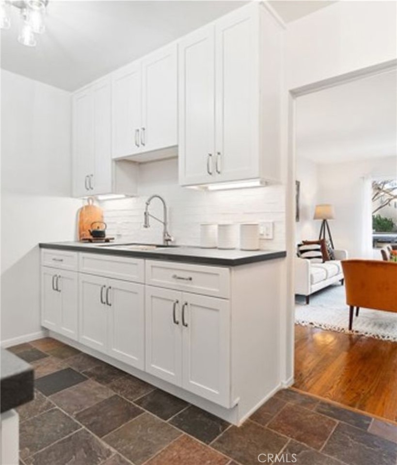 2135 East Florida Street, Unit 2 Long Beach, CA 90814 - Photo 4 of 13 a kitchen with granite countertop white cabinets and white appliances