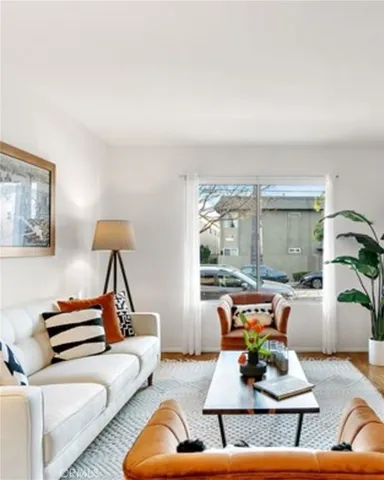 a living room with furniture and a lamp