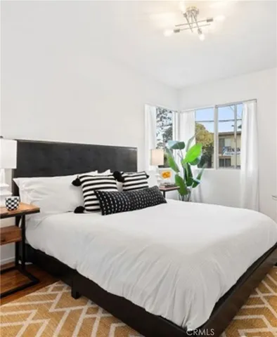 a bedroom with a bed and window