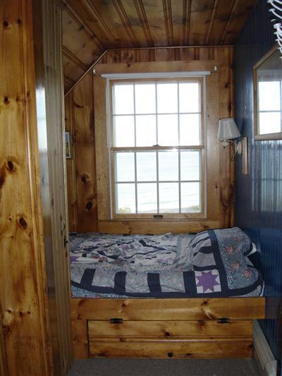 284 Ocean View Drive Wellfleet, MA 02667 - Photo 18 of 34 a bedroom with a bed and a window
