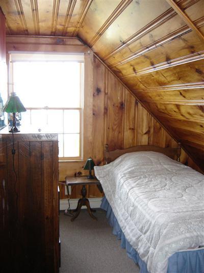 284 Ocean View Drive Wellfleet, MA 02667 - Photo 23 of 34 a bed sitting in a room next to a window