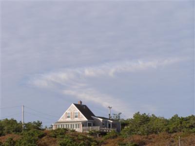284 Ocean View Drive Wellfleet, MA 02667 - Photo 33 of 34 a front view of a house with garden