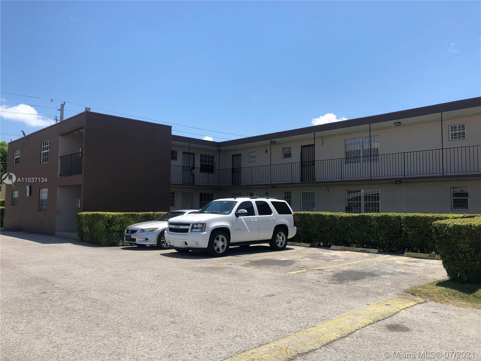 10740 Southwest 3rd Street, Unit 204 Sweetwater, FL 33174 - Photo 3 of 8 a car parked in front of a building