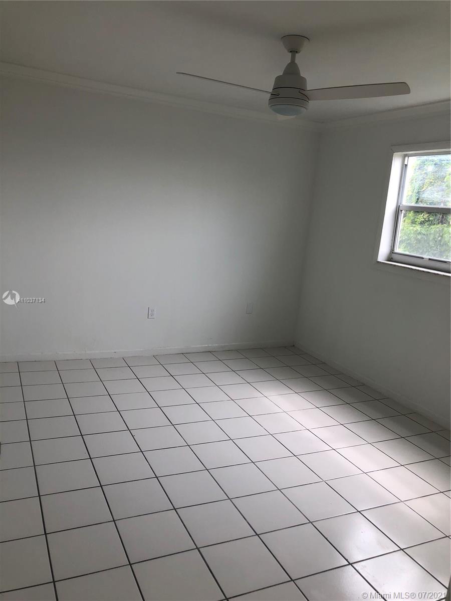10740 Southwest 3rd Street, Unit 204 Sweetwater, FL 33174 - Photo 7 of 8 a view of room and window