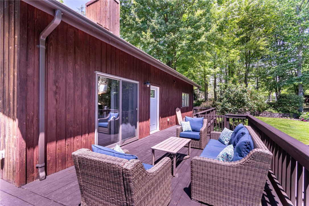 7733 East Port Bay Road Wolcott, NY 14590 - Photo 11 of 49 Imagine enjoying this deck area overlooking the pool!