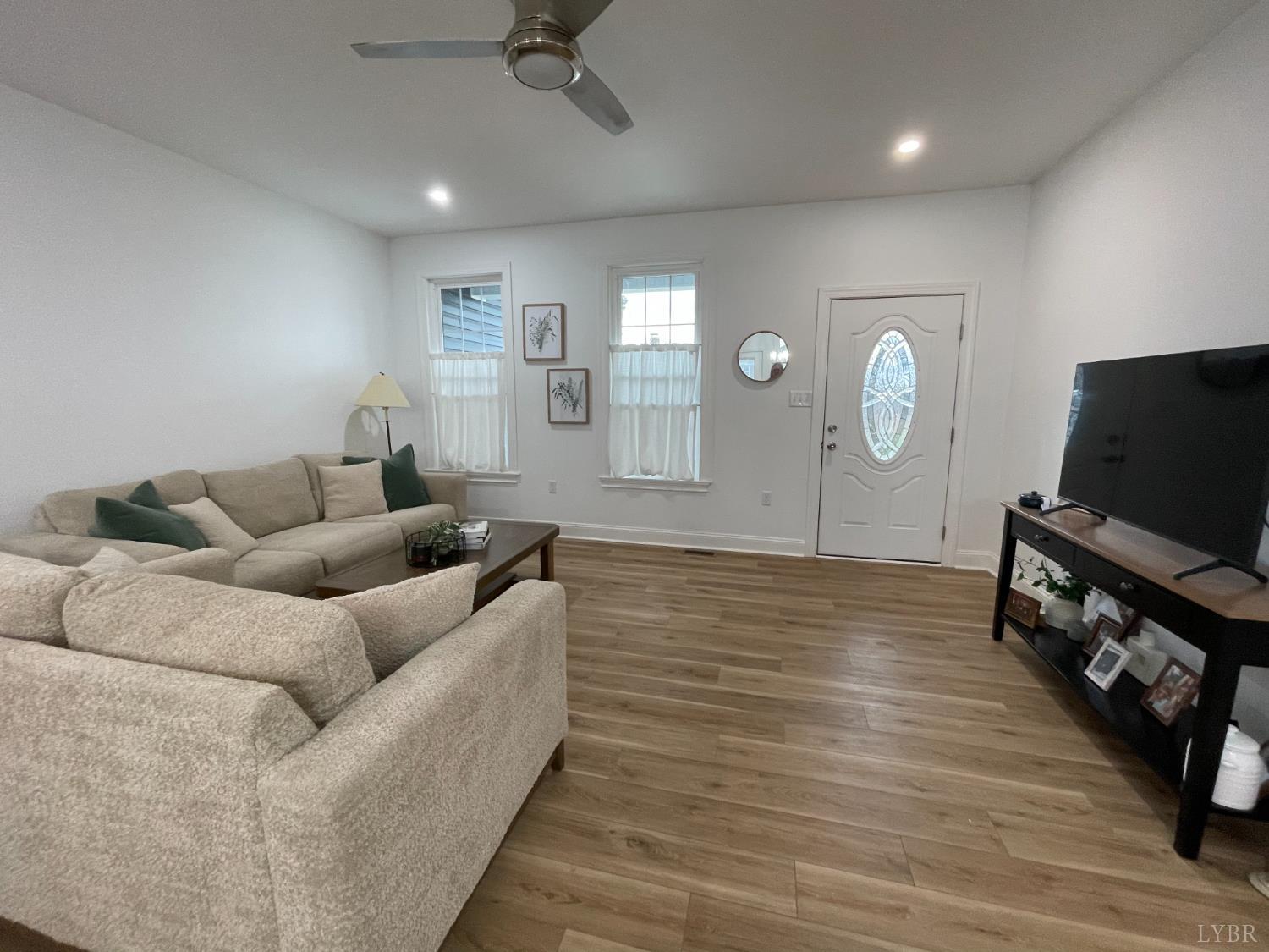 708 Grove Street Bedford, VA 24523 - Photo 13 of 22 a living room with furniture and a flat screen tv