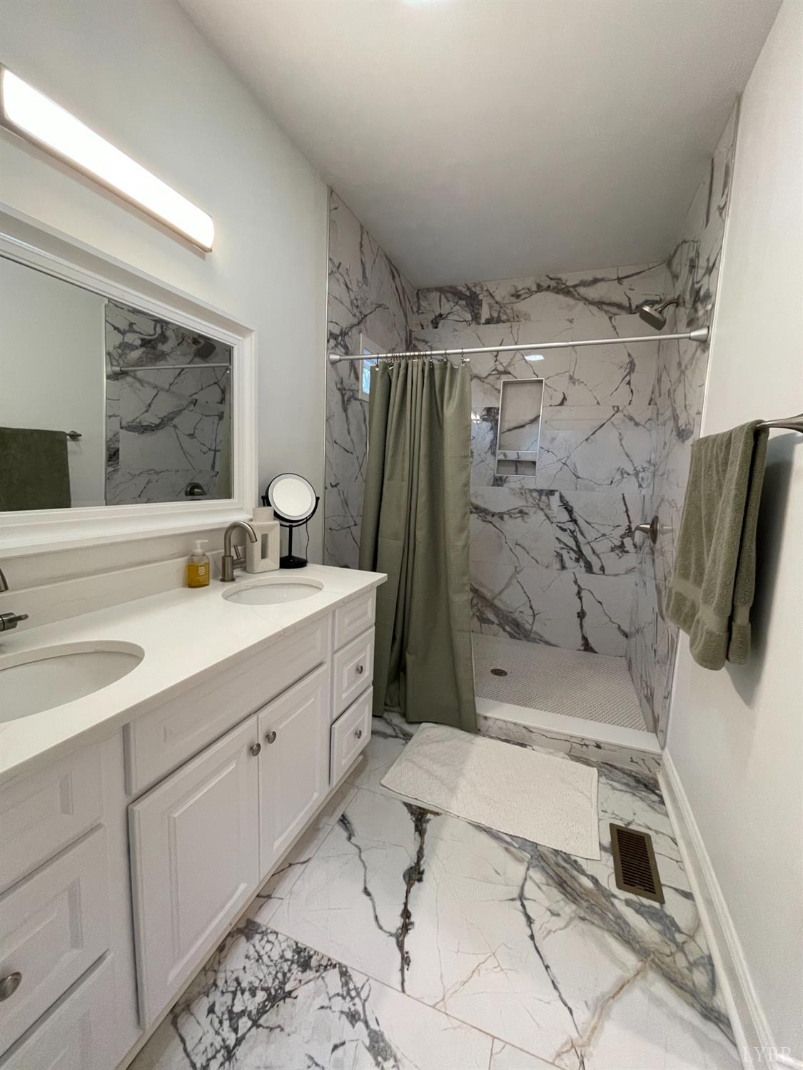 708 Grove Street Bedford, VA 24523 - Photo 17 of 22 a bathroom with a sink and a mirror