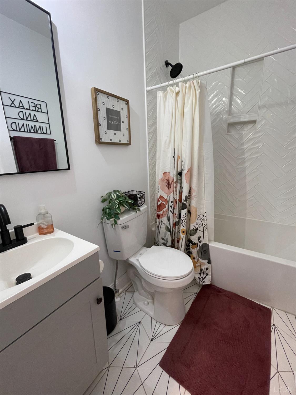 708 Grove Street Bedford, VA 24523 - Photo 2 of 22 a white toilet sitting next to a bathroom sink