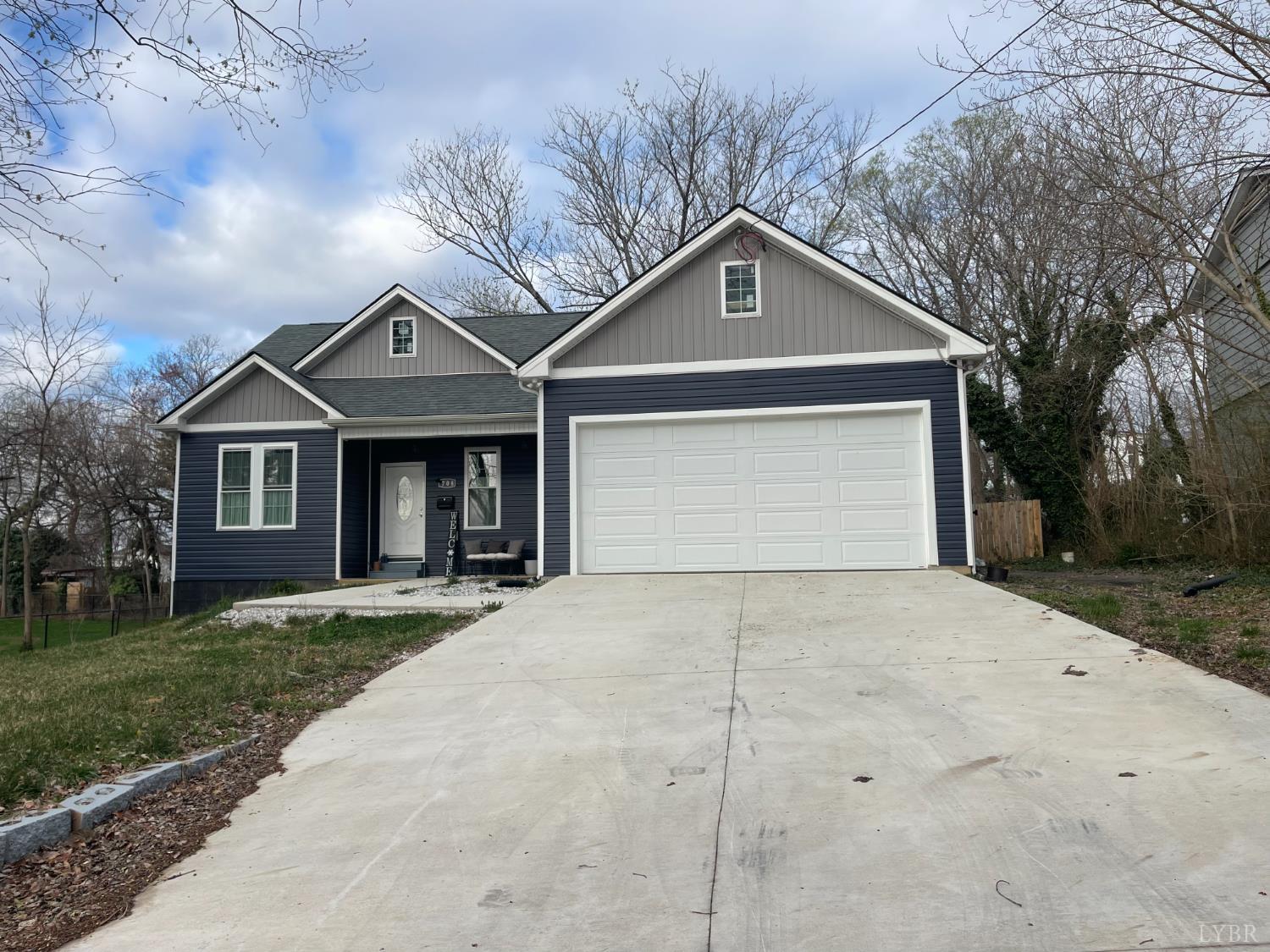 708 Grove Street Bedford, VA 24523 - Photo 22 of 22 a front view of a house with a yard and garage