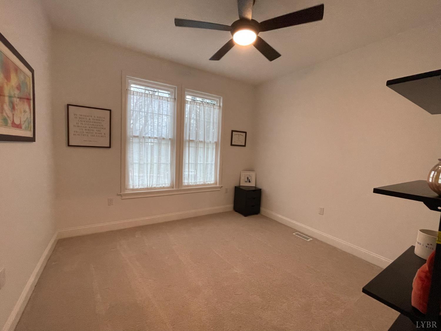 708 Grove Street Bedford, VA 24523 - Photo 4 of 22 a view of an empty room with a window
