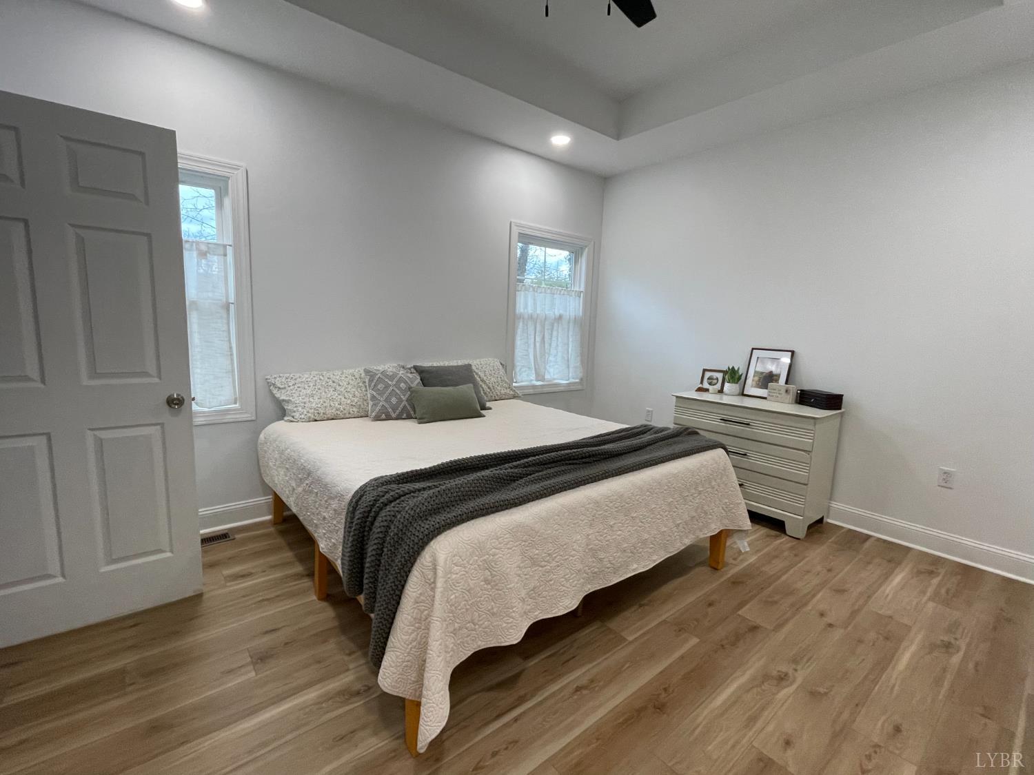 708 Grove Street Bedford, VA 24523 - Photo 8 of 22 a bedroom with a bed and wooden floor