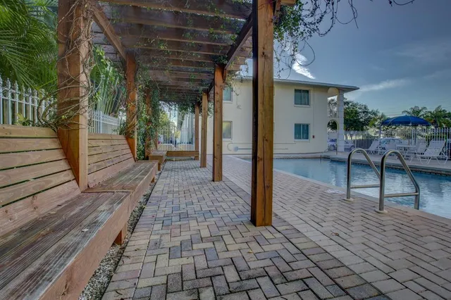 a view of a porch with wooden floor