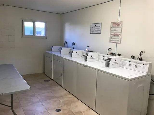 a utility room with a window dryer and washer