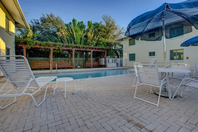 a view of a chairs and tables in the patio