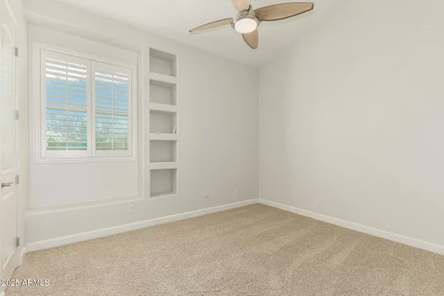 a view of a house with swimming pool and sitting area