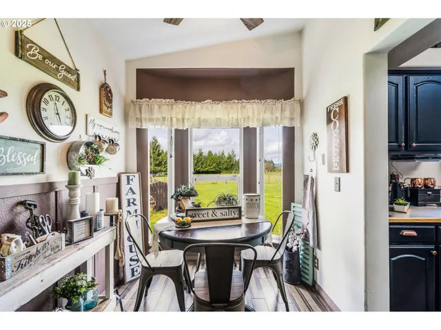 a view of a dining room with furniture window and outside view