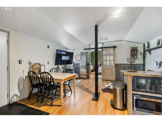 a view of a dining room with furniture window and wooden floor
