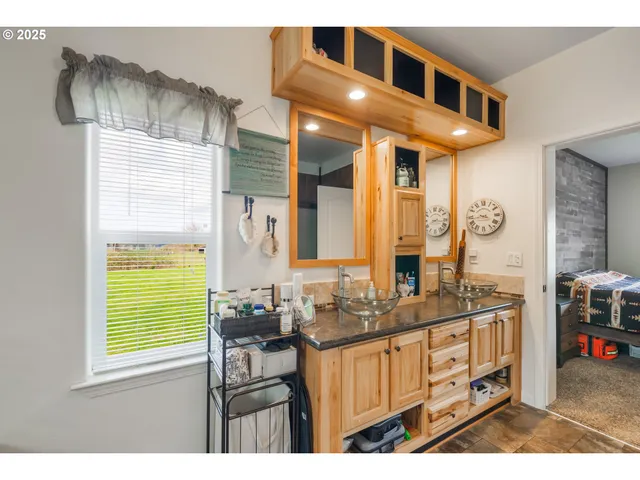 a bathroom with a sink a vanity and a mirror