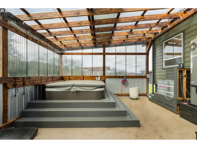 a view of a patio with table and chairs