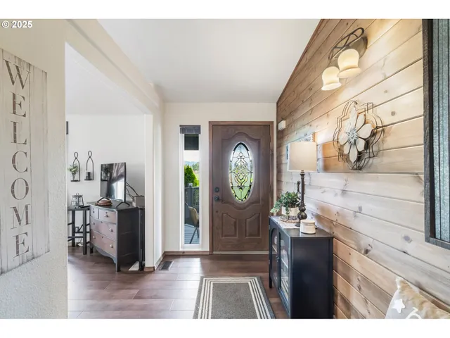 a living room with furniture and a dining table