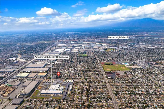 an aerial view of residential building and lake