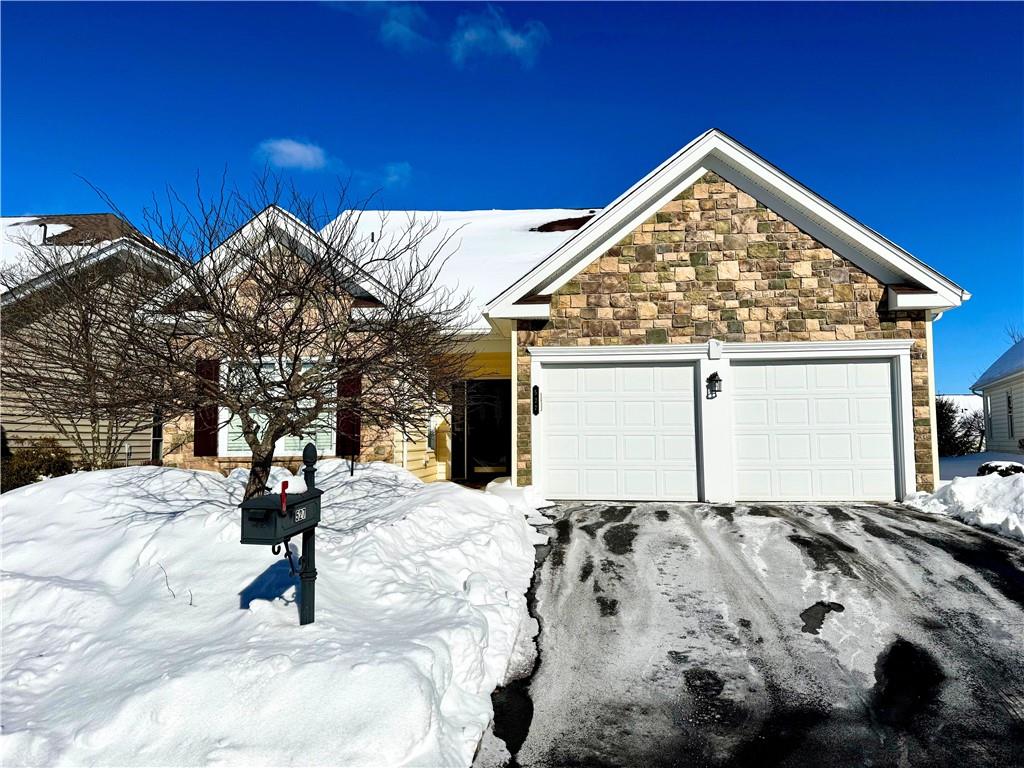 a view of a house with a snow in the yard